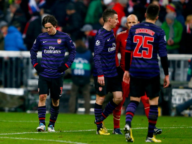 Tomas Rosicky (à gauche) d'Arsenal réagit après les huitièmes de finale retour de la Ligue des champions de son équipe, le 13 mars 2013.