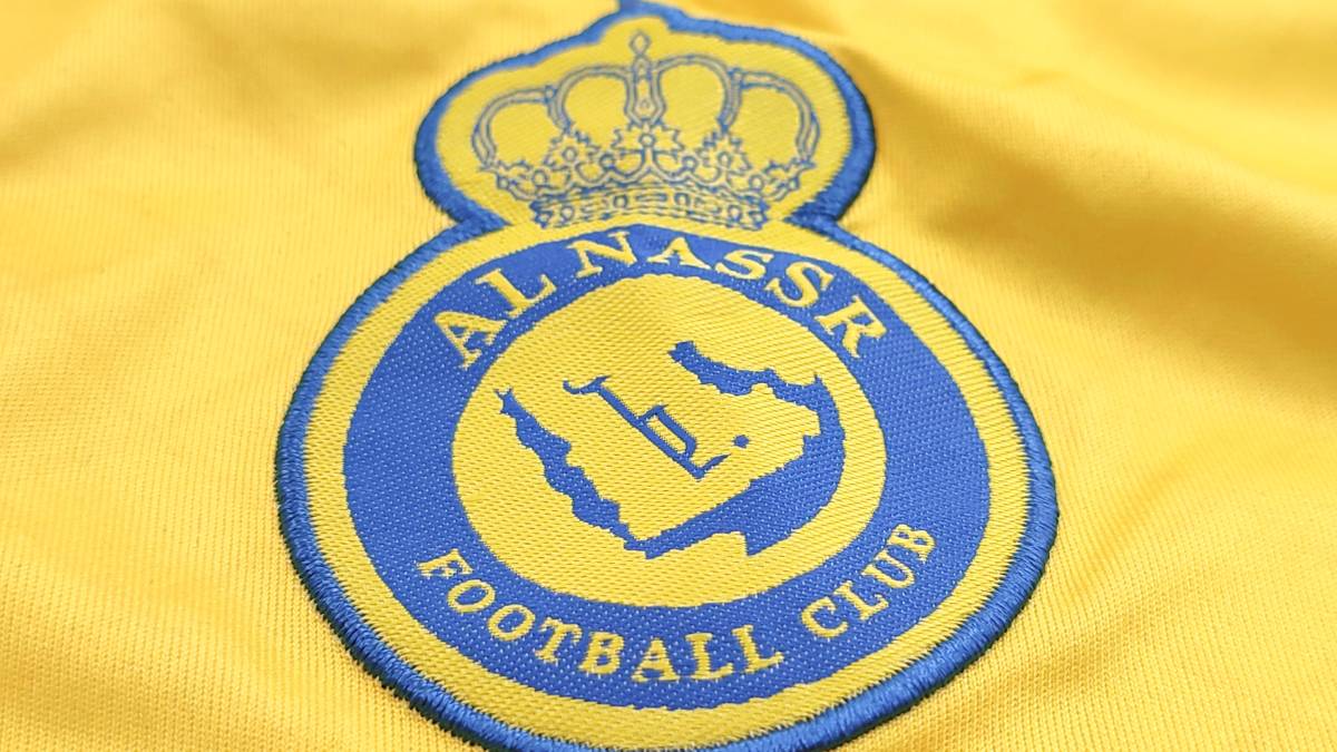 The shirt, badge and logo of Saudi Pro League football club Al Nassr
