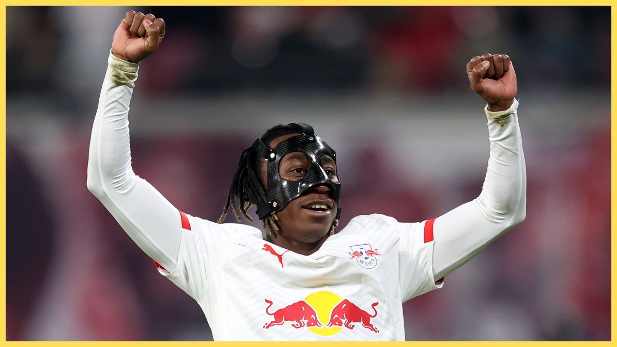 Yan Diomande pumps his arms in the air in celebration.