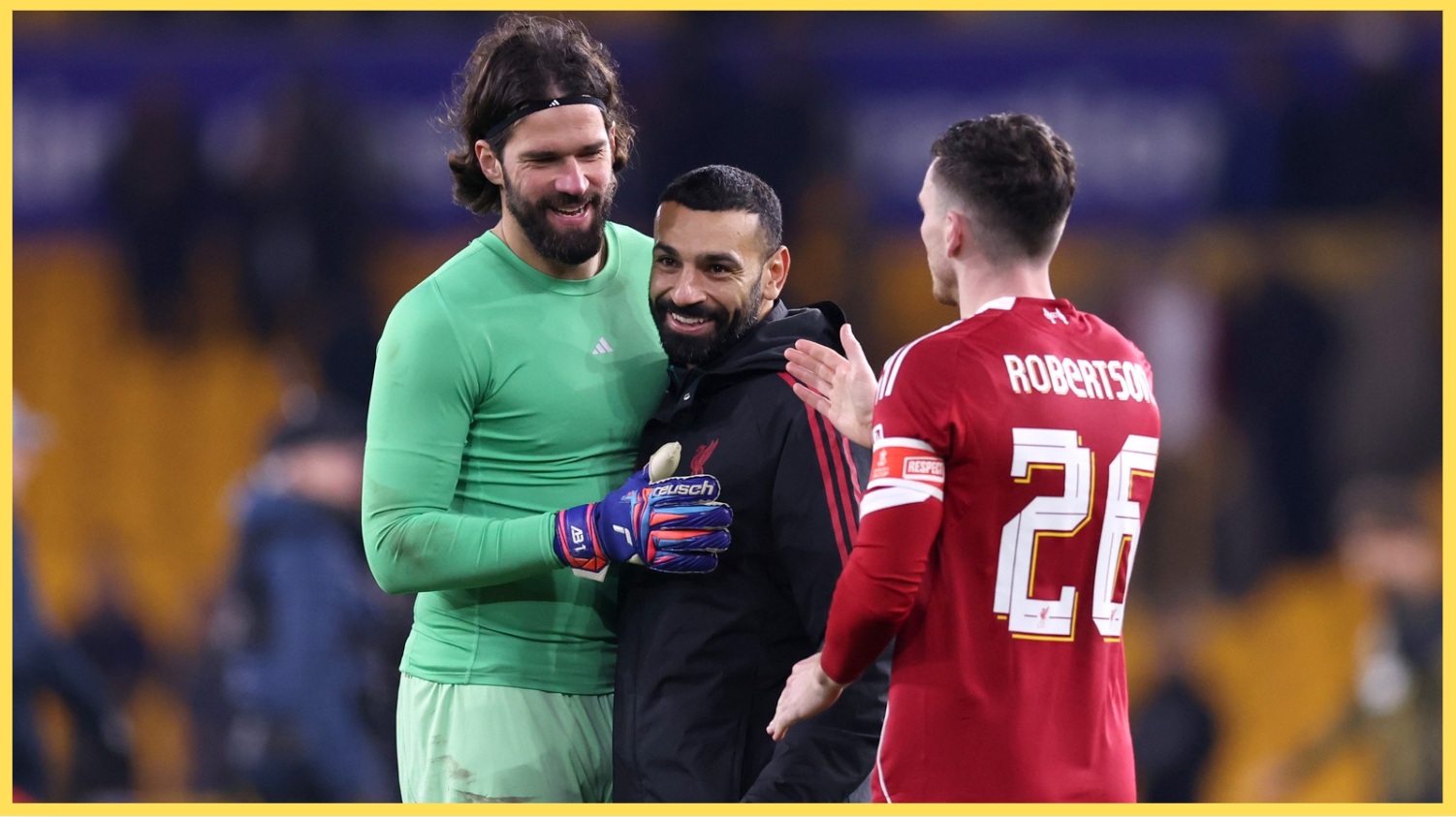 Alisson and Andy Robertson celebrate with Mo Salah after Liverpool