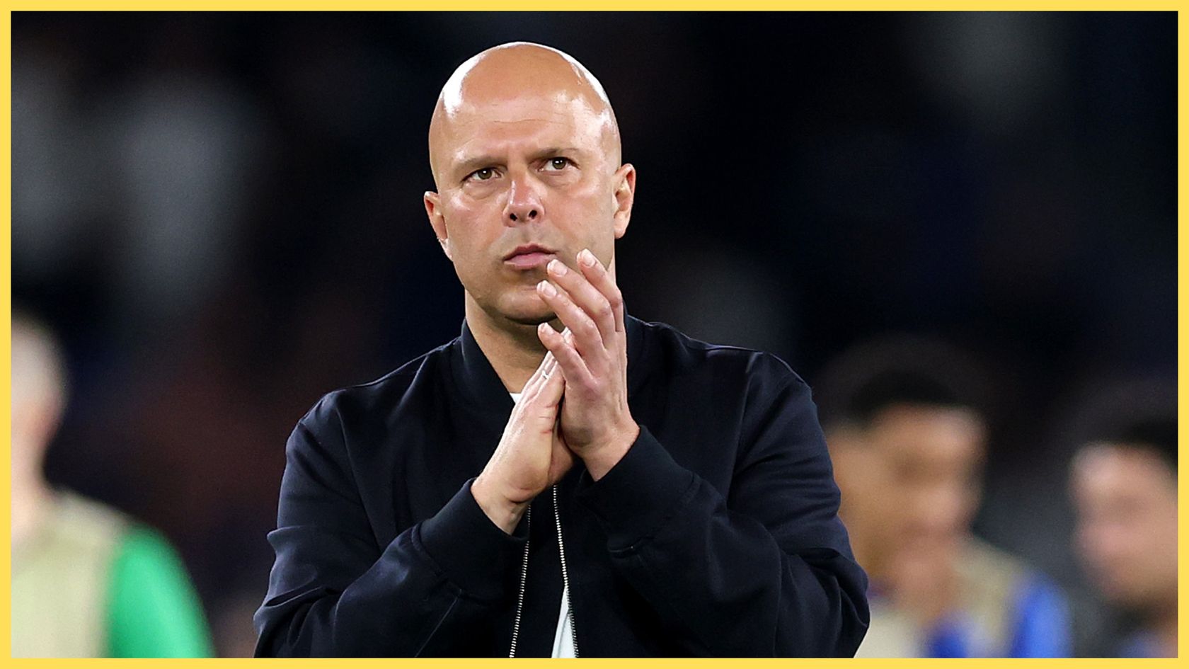 Arne Slot claps his hands during Liverpool game.