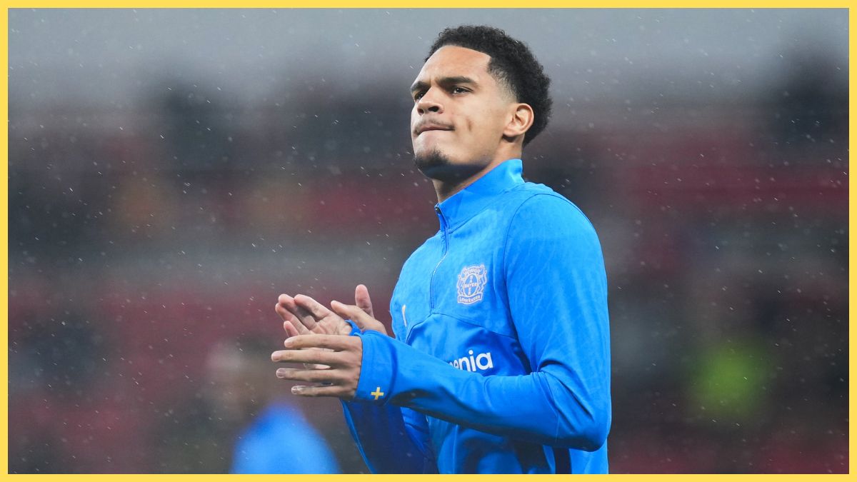 Jarell Quansah of Bayer 04 Leverkusen acknowledges the supporters during the warm up prior to UEFA Champions League 2025/26 Round of 16 First Leg match between Bayer 04 Leverkusen and Arsenal FC at BayArena