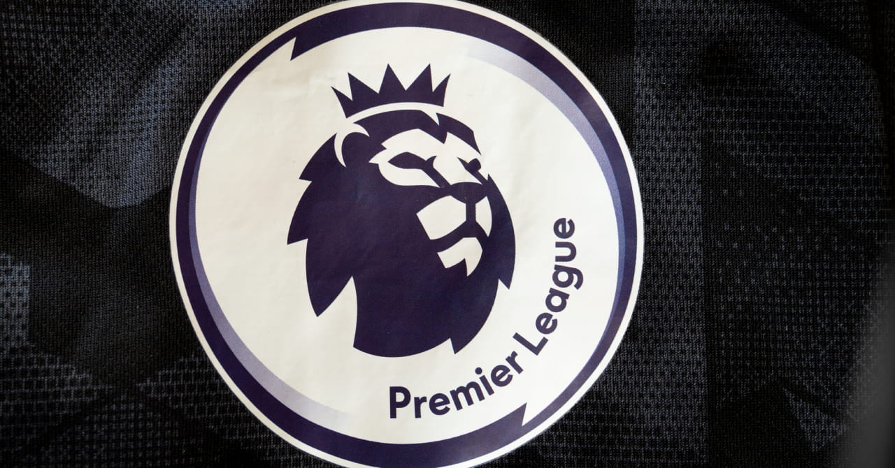 The Premier League football competition logo showing a graphic of a lion wearing a crown and looking to the left in dark print on a circular white background against a dark square