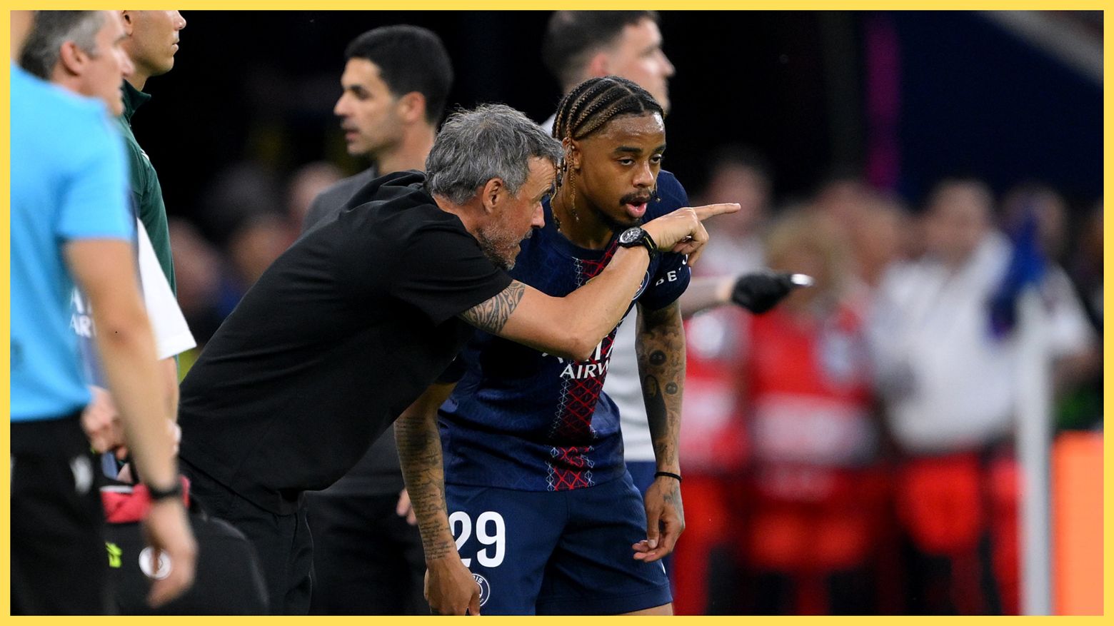 PSG manager Luis Enrique gestures at the pitch to Liverpool transfer target Bradley Barcola.
