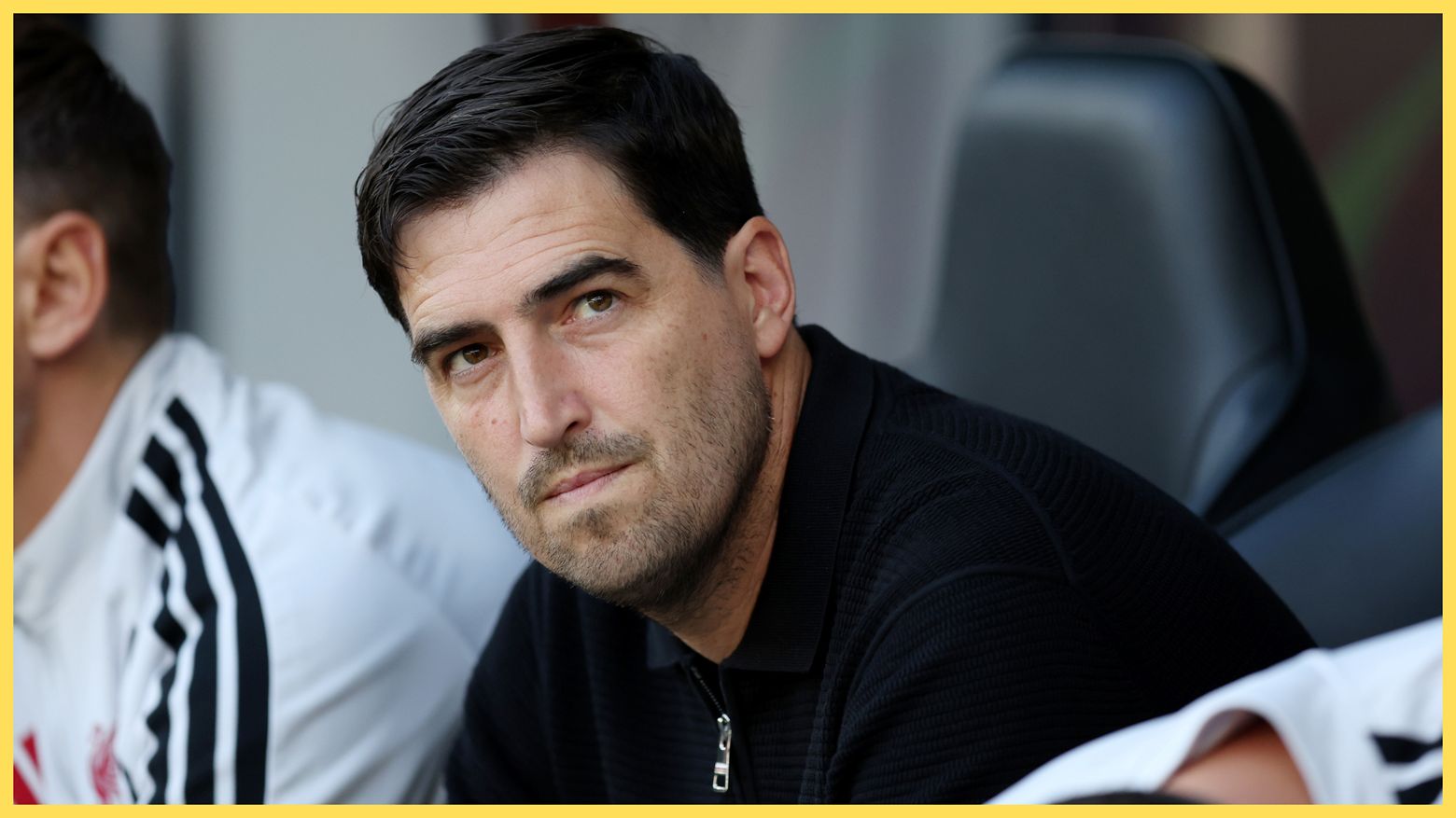 Liverpool manager Andoni Iraola looks on from the bench.